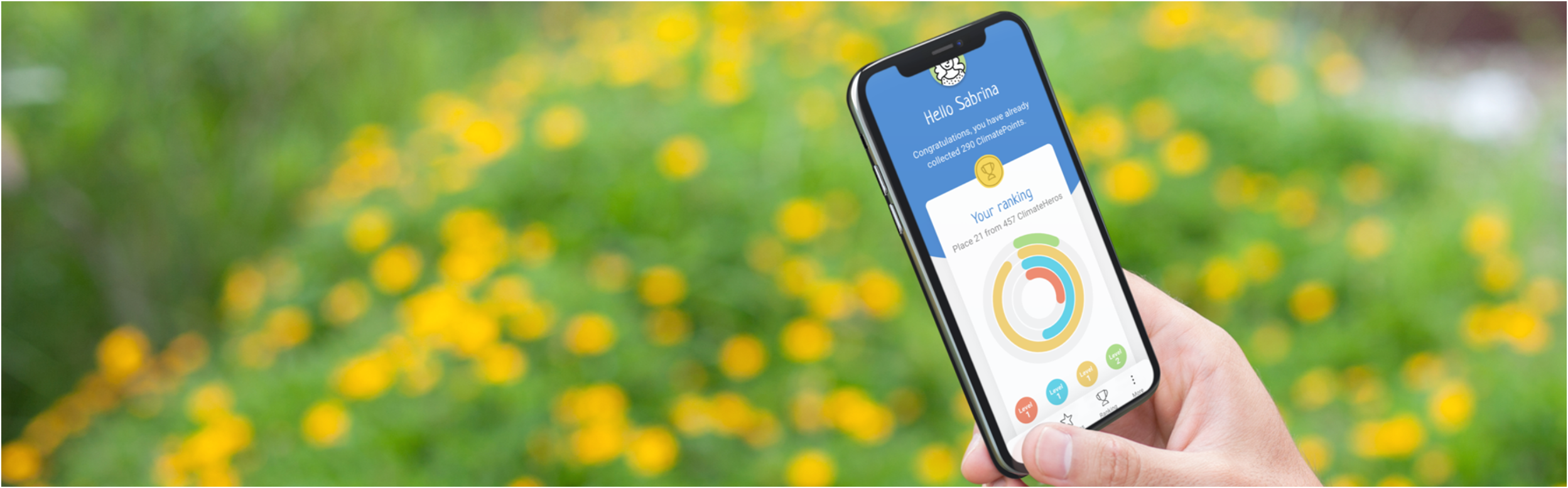 Banner Handy und App ClimateActions mit Busch mit Blumen im Hintergrund